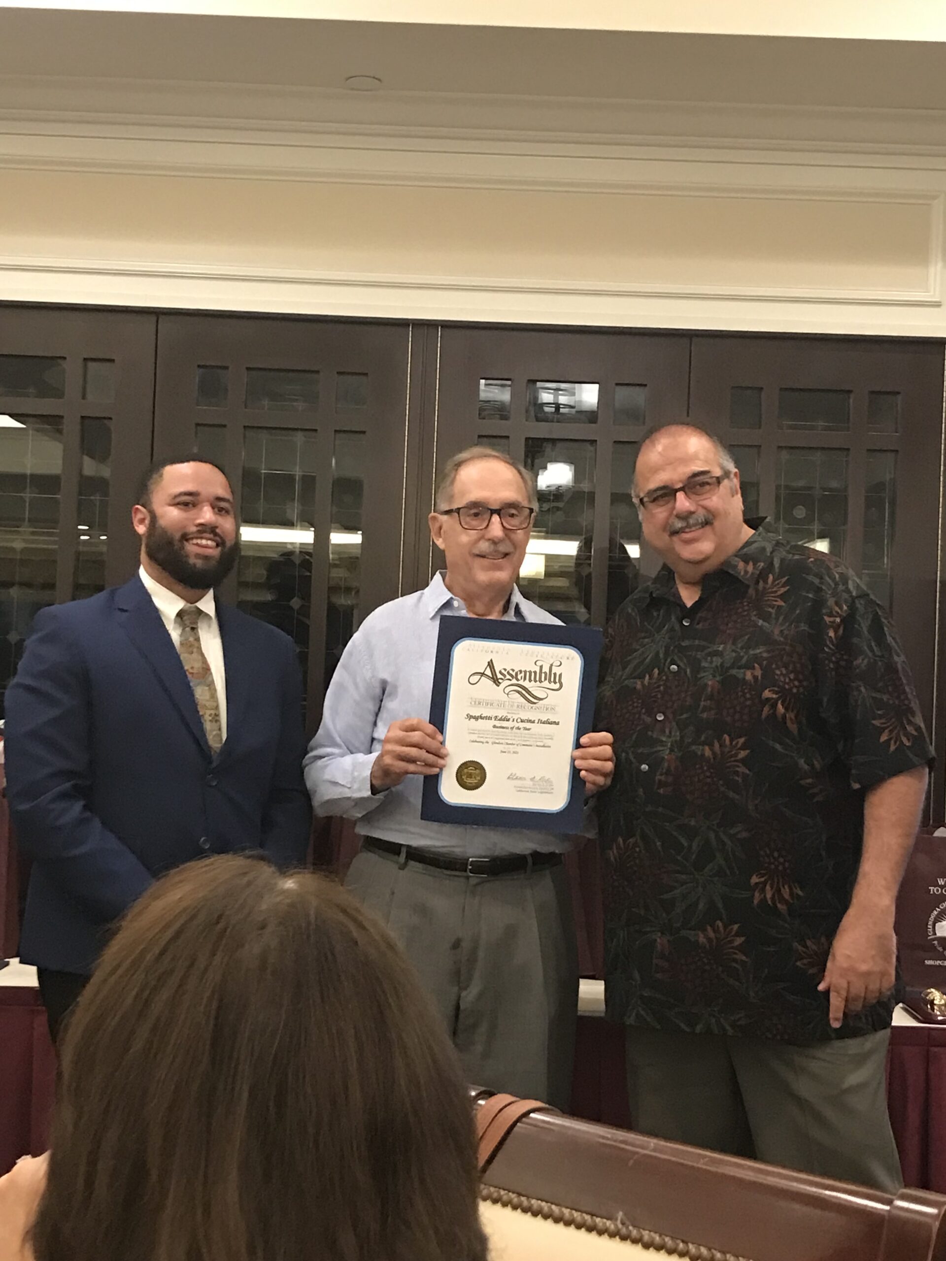 Spaghetti Eddie's owners, Ed Inglese and Jim Hermanson receiving an award